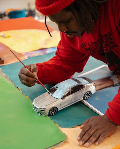 Artist Alvaro Barrington working on the limited BMW i7 miniature edition, presented at Frieze Seoul 2024.