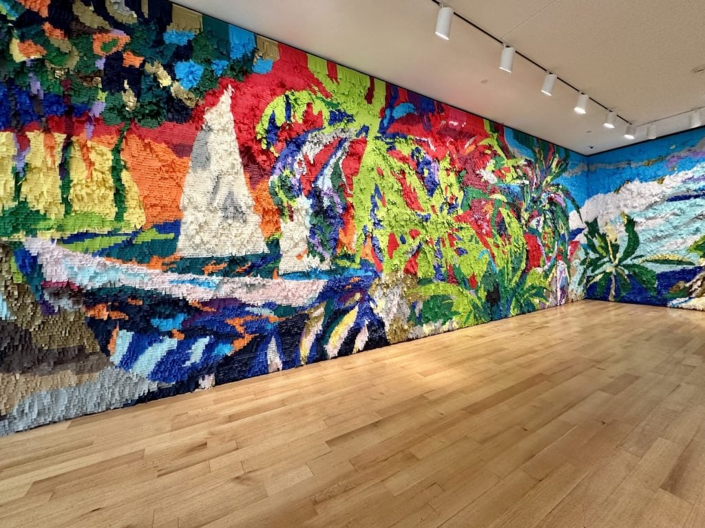 A colorful mural made of paper in an art gallery