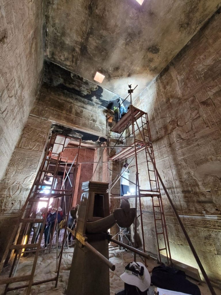 A photo of scaffolding inside the Temple of Edfu as restorations are underway.