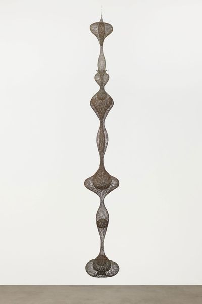 Ruth Asawa. Untitled (S.398, Hanging Eight-Lobed, Four-Part, Discontinuous Surface Form within a Form with Spheres in the Seventh and Eighth Lobes) (c. 1955). Brass wire, iron wire, and galvanized iron wire. 8′ 8 1/2″ × 14 1/2 × 14 1/2″ (265.4 × 36.8 × 36.8 cm). The Museum of Modern Art, Promised gift of Alice and Tom Tisch, 2016.