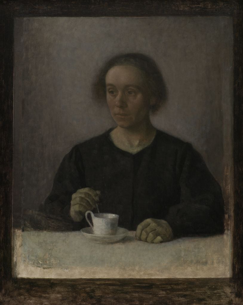 an old woman with a cup of tea