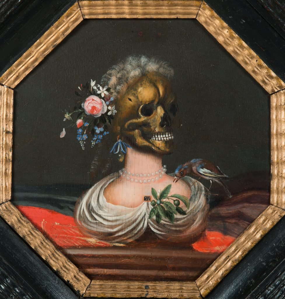 a skull with a pearl necklace, white hair, and flowers