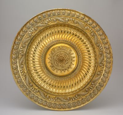 Unrecorded Asante artist, Ghana, gold pendant (1850–1873) and R & S Garrard & Co, London, silver-gilt dish (1874).