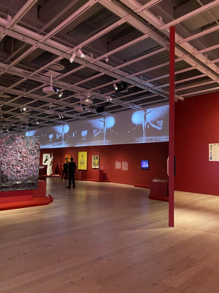 an image of a multimedia installation featuring video and artworks