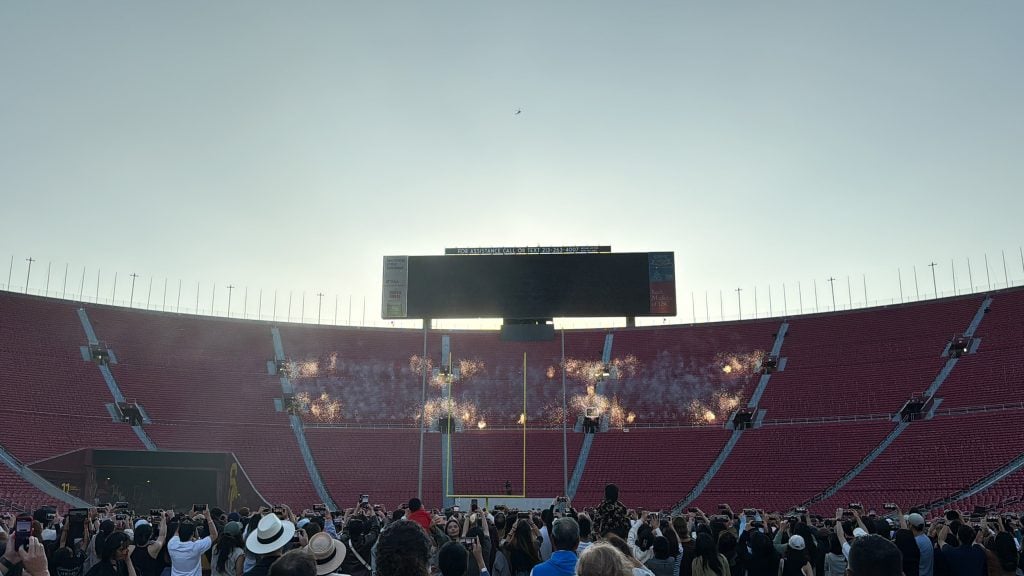 A group of fireworks going off in the bleachers of a stadium