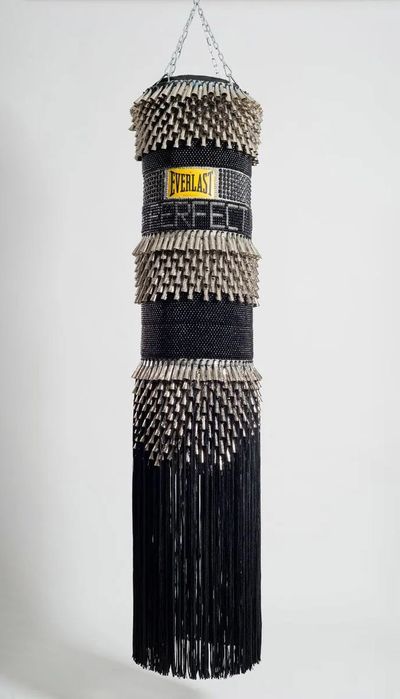 Jeffrey Gibson, I'm Not Perfect (2014). Found canvas punching bag, repurposed wool army blanket, glass beads, tin jingles, nylon fringe, artificial sinew, acrylic paint. 191.8 x 40.6 x 40.6 cm.