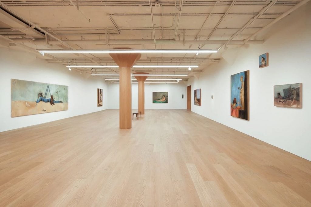 An art gallery with paintings on the walls