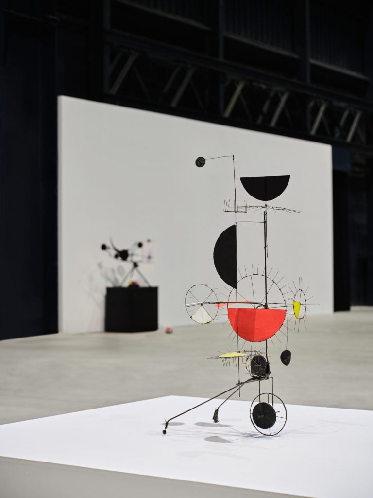 industrial Jean Tinguely sculptures are in an art gallery 