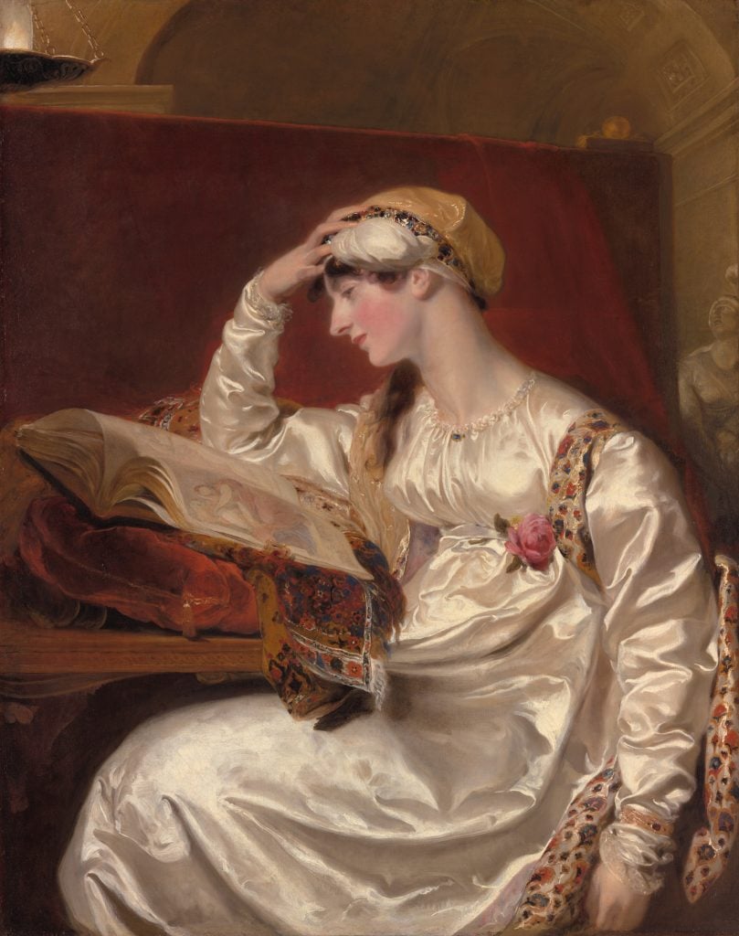 a painting in which a woman in a ravishing whtie dress props her head up with one hand as she contemplates a hefty open book